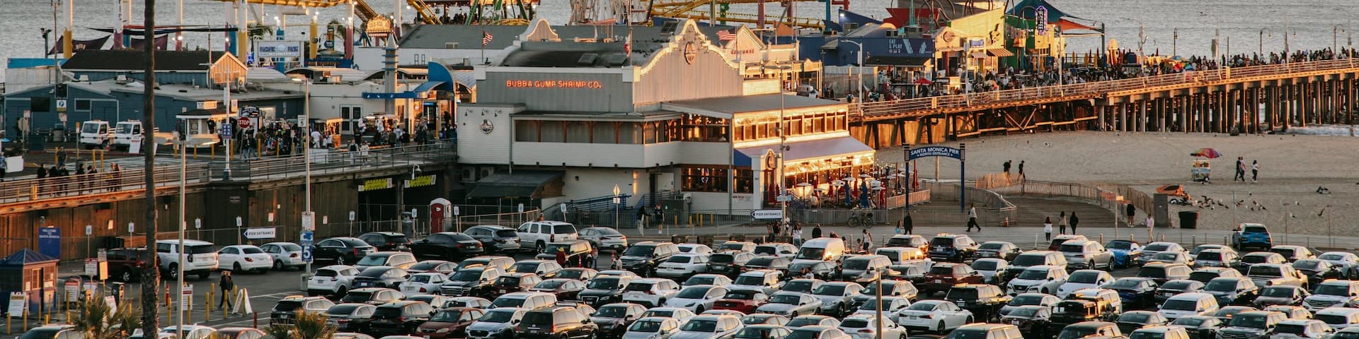 Downtown Santa Monica which includes a coastal town, a sunset and landscape views