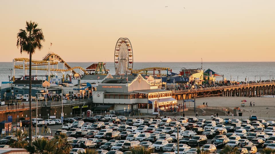 Downtown Santa Monica which includes a coastal town, a sunset and landscape views