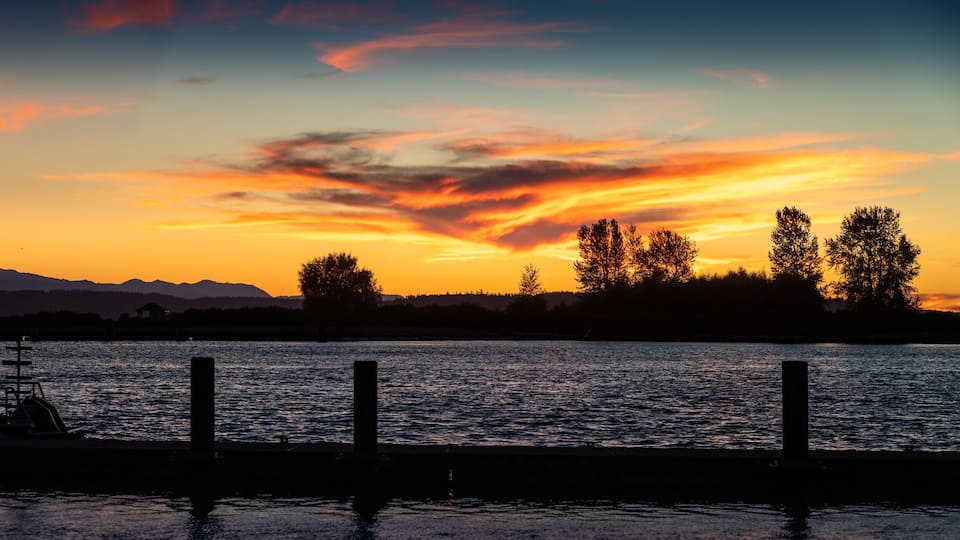 Panorama of sunset on water Jetty Island Port Gardner Everett Washington