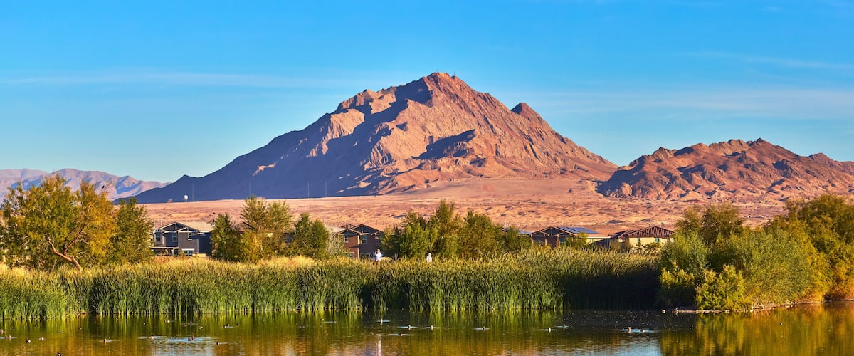Mountain Sunrise Over Pond and Lush Greenery at Henderson Bird Viewing Preserve