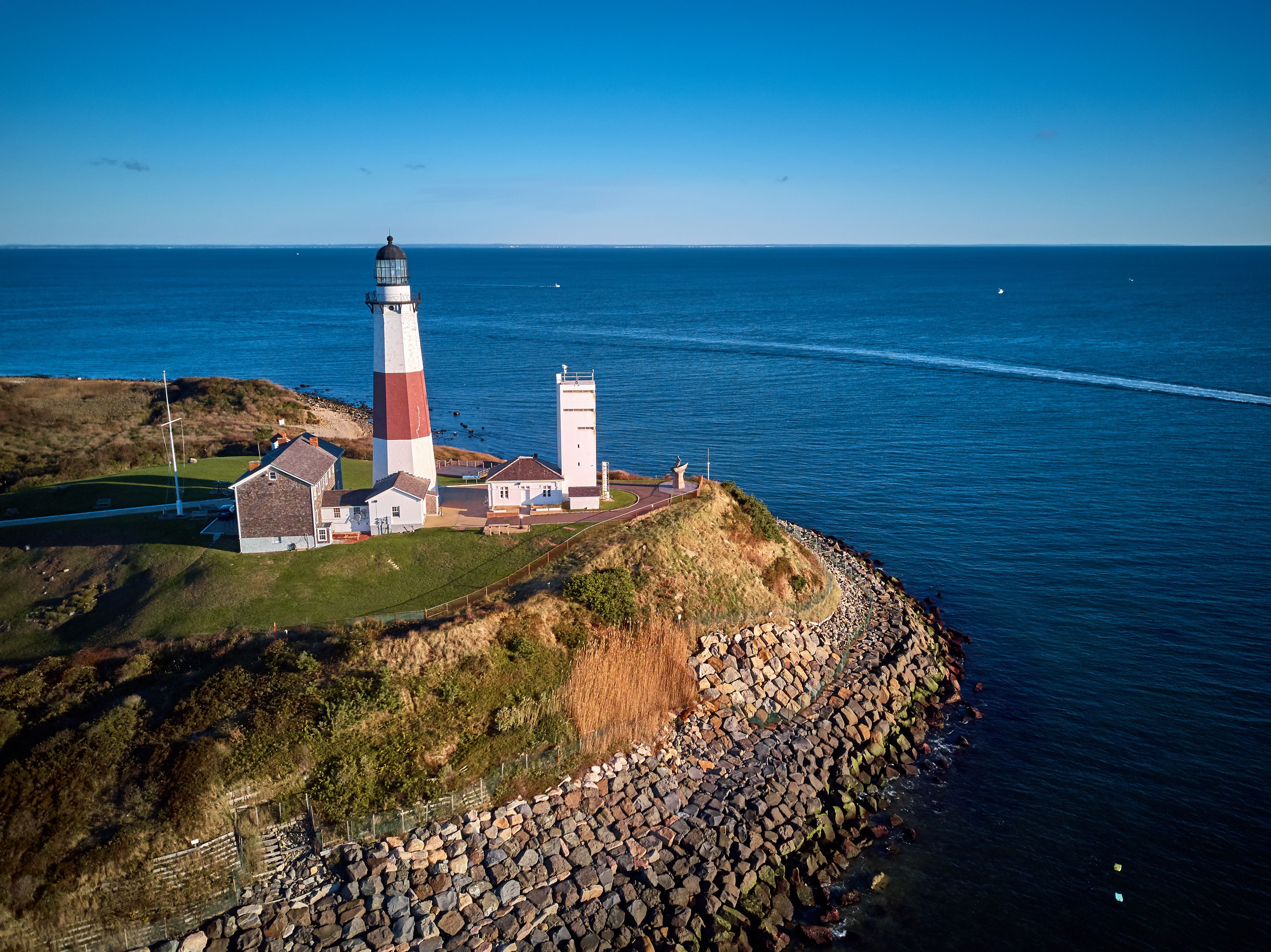 Montauk Lighthouse and beach aerial shot, Long Island, New York, USA.