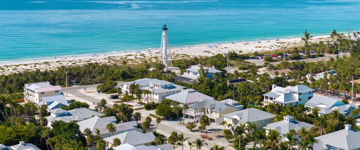 American waterfront houses and white lighthouse in island small town Boca Grande on Gasparilla Island in southwest Florida