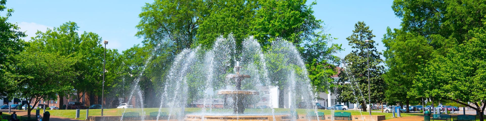 Wilson Park Fountain Downtown Florence Alabama Spring Sunny with Two Concrete Benches on either Side