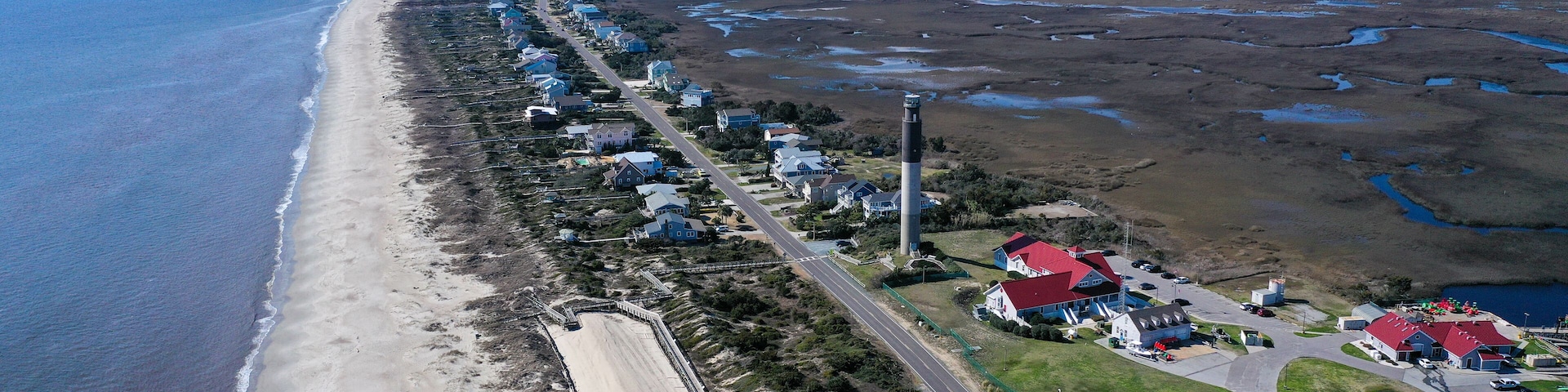 Aerial view of Caswell Beach and lighthouse