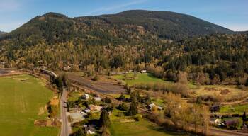 Aerial View of Chuckanut Drive. As you approach the base of the Chuckanut Mountains and just as the road begins its climb, you’ll find the small community of Blanchard, founded in 1887.