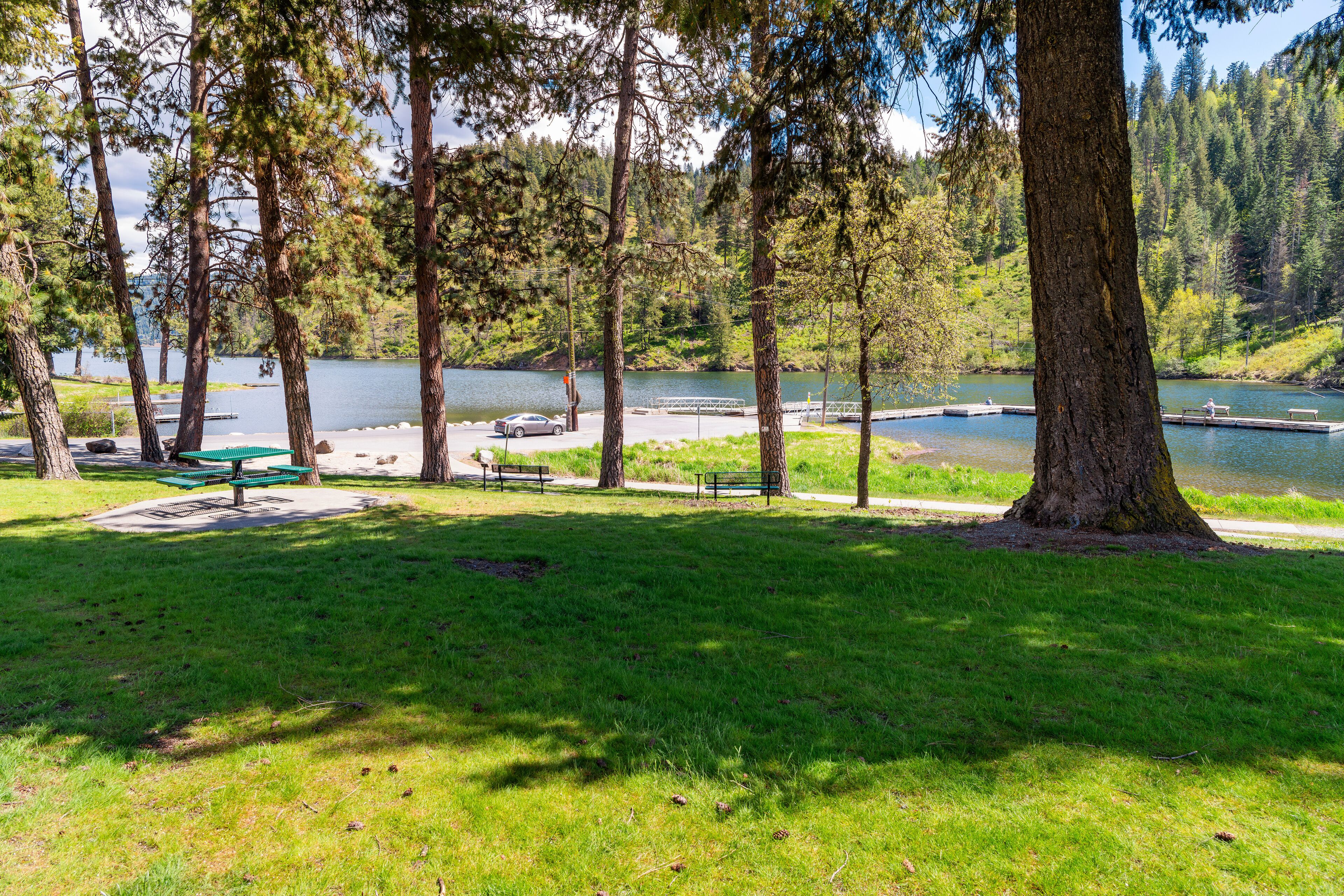 View from the small public Fernan Park and Boat Launch, a lakefront park and fishing spot along Fernan Lake in the downtown district of Coeur d'Alene, Idaho USA.