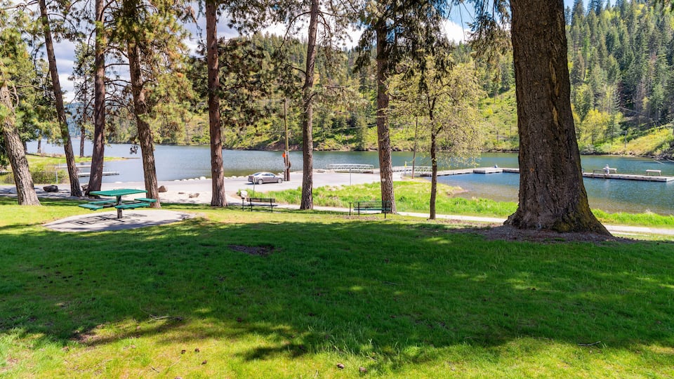 View from the small public Fernan Park and Boat Launch, a lakefront park and fishing spot along Fernan Lake in the downtown district of Coeur d'Alene, Idaho USA.