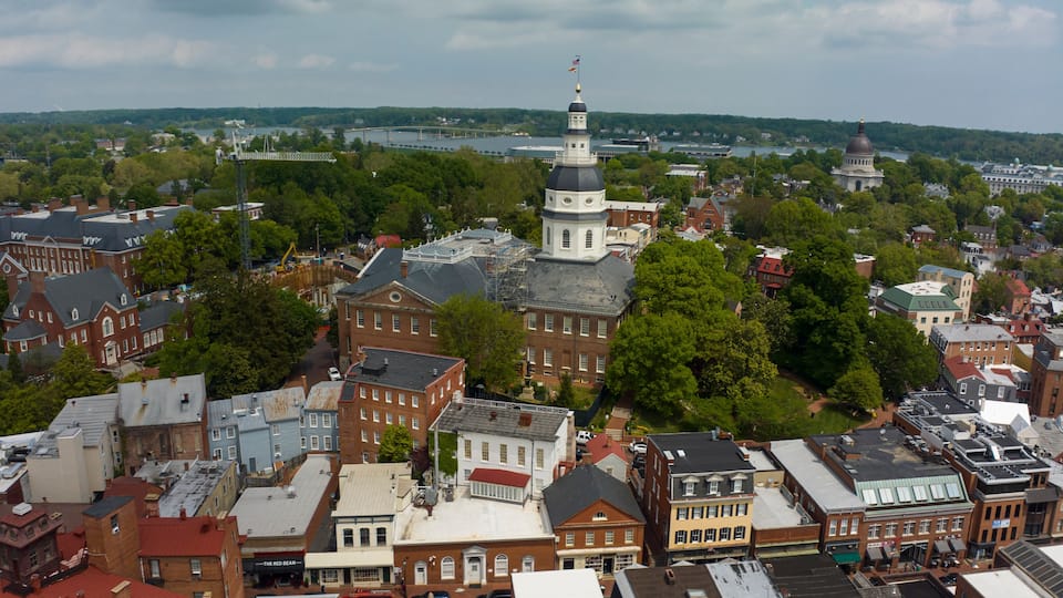 APRIL 27, 2023, ANNAPOLIS, MD., USA - aerial view of Annapolis State Capitol of Maryland with US Naval Academy in background on Chesepeake River
