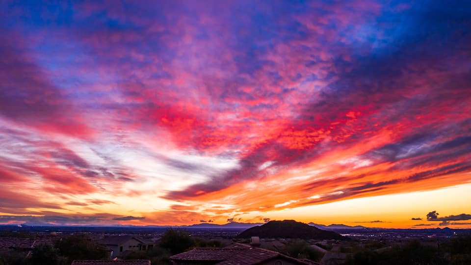 An spectacular sunset from a desert landscaped backyard in Mesa Arizona.