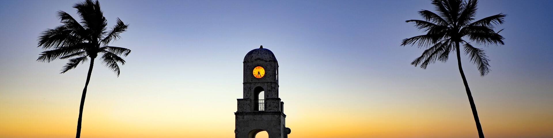 The Worth Avenue Clock Tower on Palm Beach, Florida at dawn, on the ocean.