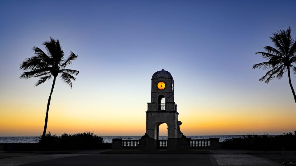 The Worth Avenue Clock Tower on Palm Beach, Florida at dawn, on the ocean.