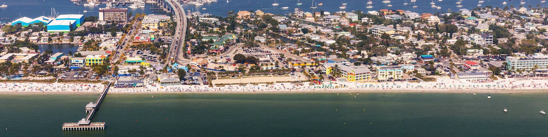 Fishing Pier Fort Myers Beach. Aerial view to the large white sandy beach on the Estero Island, Florida