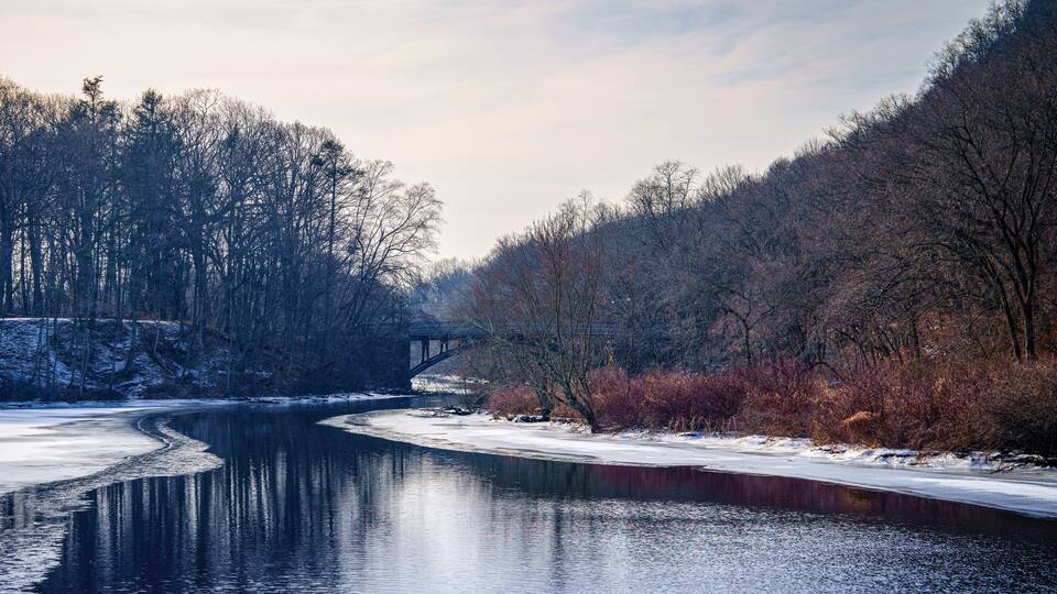 New England Winter Landscape over the Mill River, East Rock Park in New Haven, Connecticut, USA