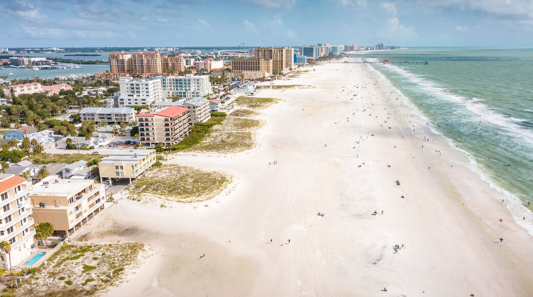 Top the best beaches in the world. Wide and long Ocean beach. Summer or autumn vacation. Location Clearwater beach Florida. American Coast or shore. Island in Gulf of Mexico. Aerial view of city.