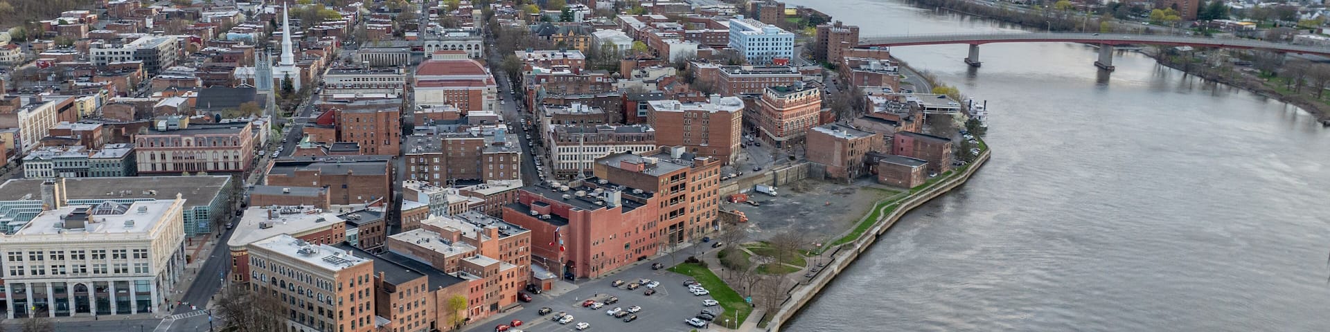 Late afternoon spring aerial view of downtown Troy, NY located on the Hudson River.