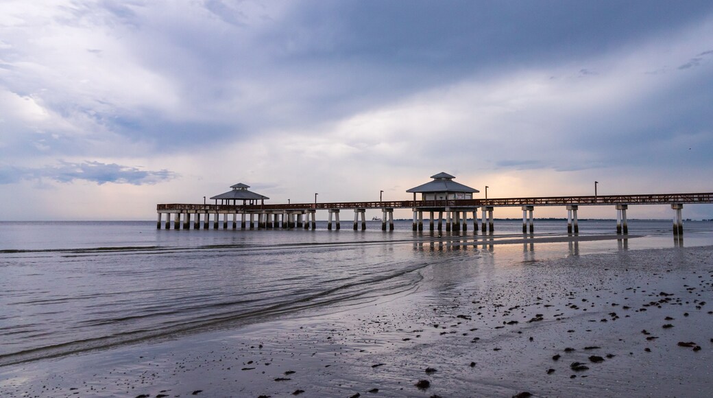 Fishing Pier on a South west Florida Beach during sunset after a storm days before hurricane Dorian calm and relaxing