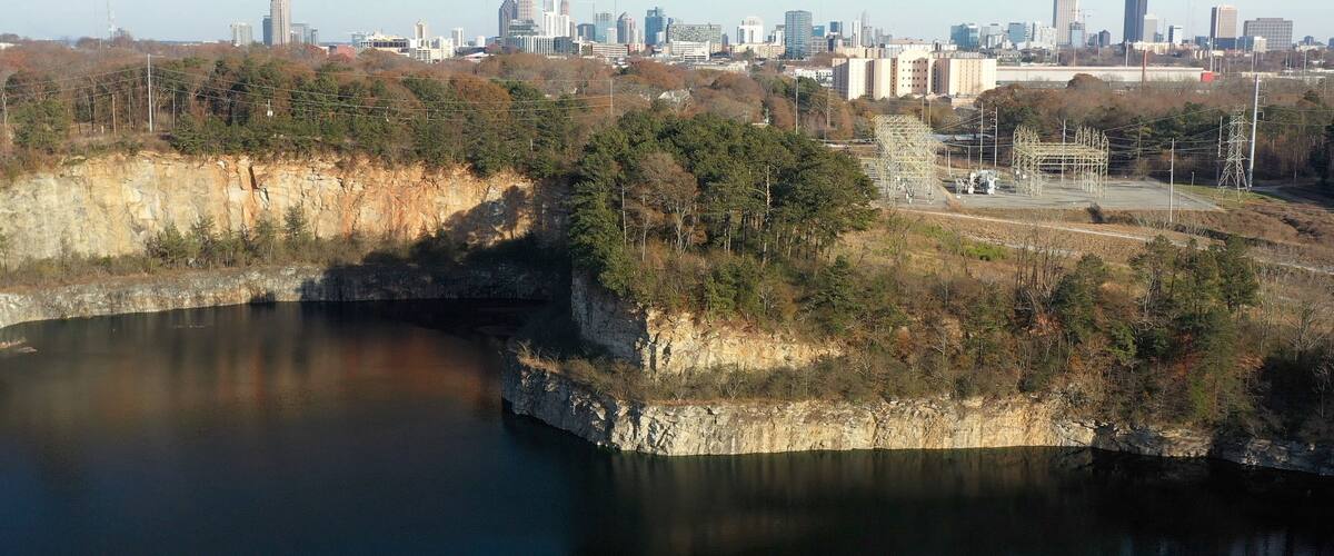 Bellwood quarry Westside park outside of Atlanta Georgia with city skyline on horizon