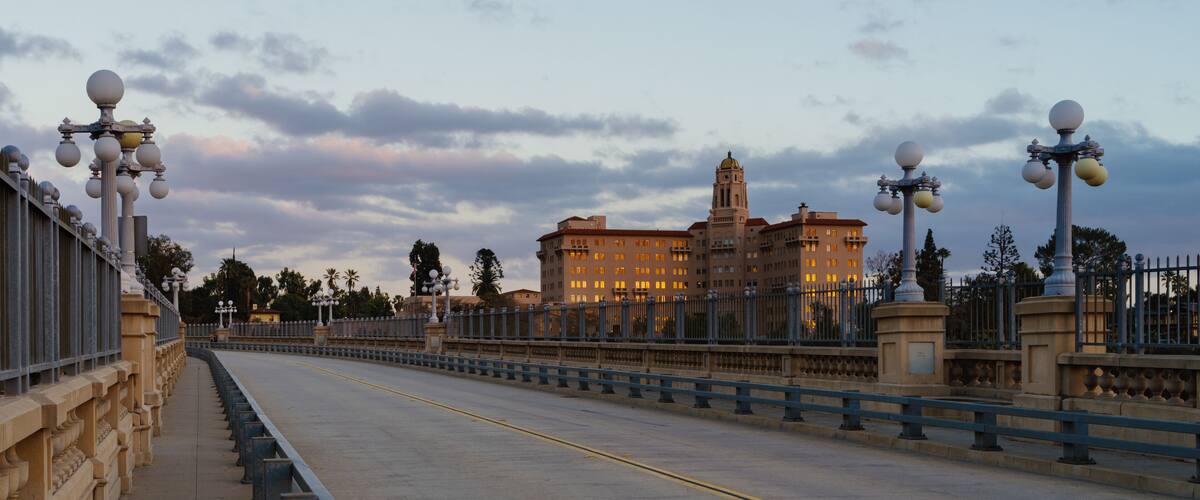 The Colorado Street Bridge and courthouse building shown in the City of Pasadena, California at sunset time.