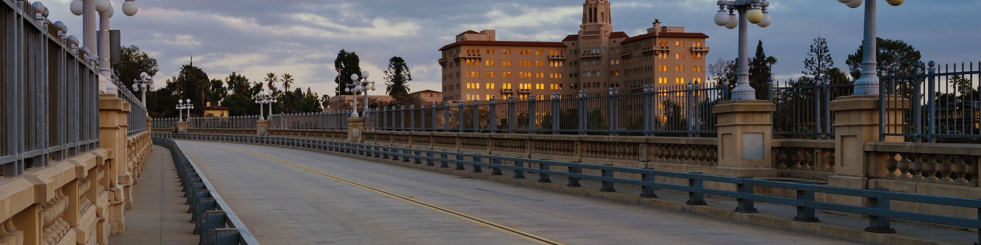 The Colorado Street Bridge and courthouse building shown in the City of Pasadena, California at sunset time.