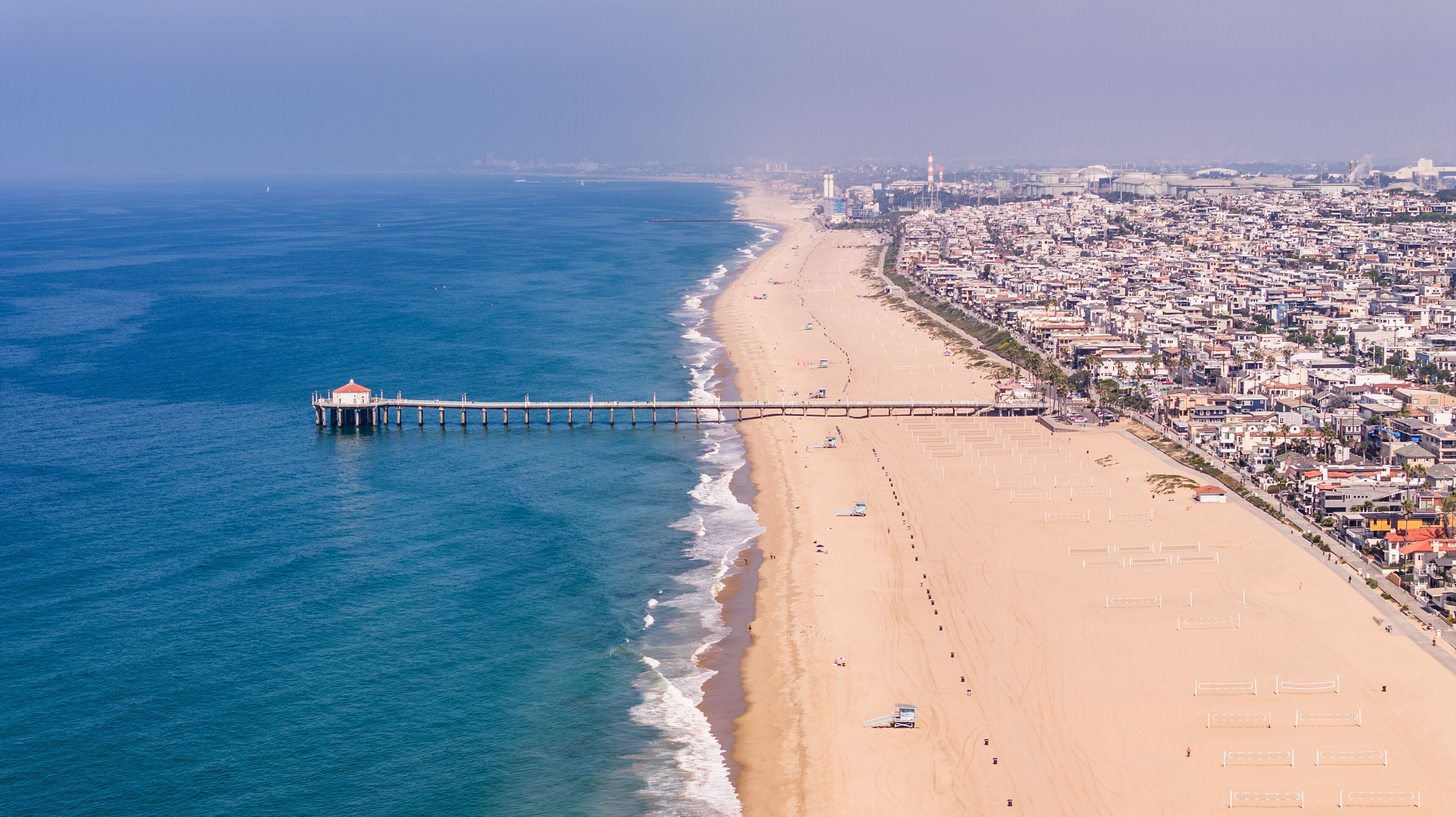 Manhattan Beach, Los Angeles, California, USA - 23-10-1, aerial landscape view along Manhattan Beach with Manhattan Beach Pier which protrudes into the water of Pacific Ocean