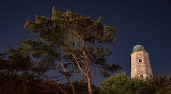 Cape Henry Lighthouse in Fort Story Virginia at night. Both the old and new lighthouse.