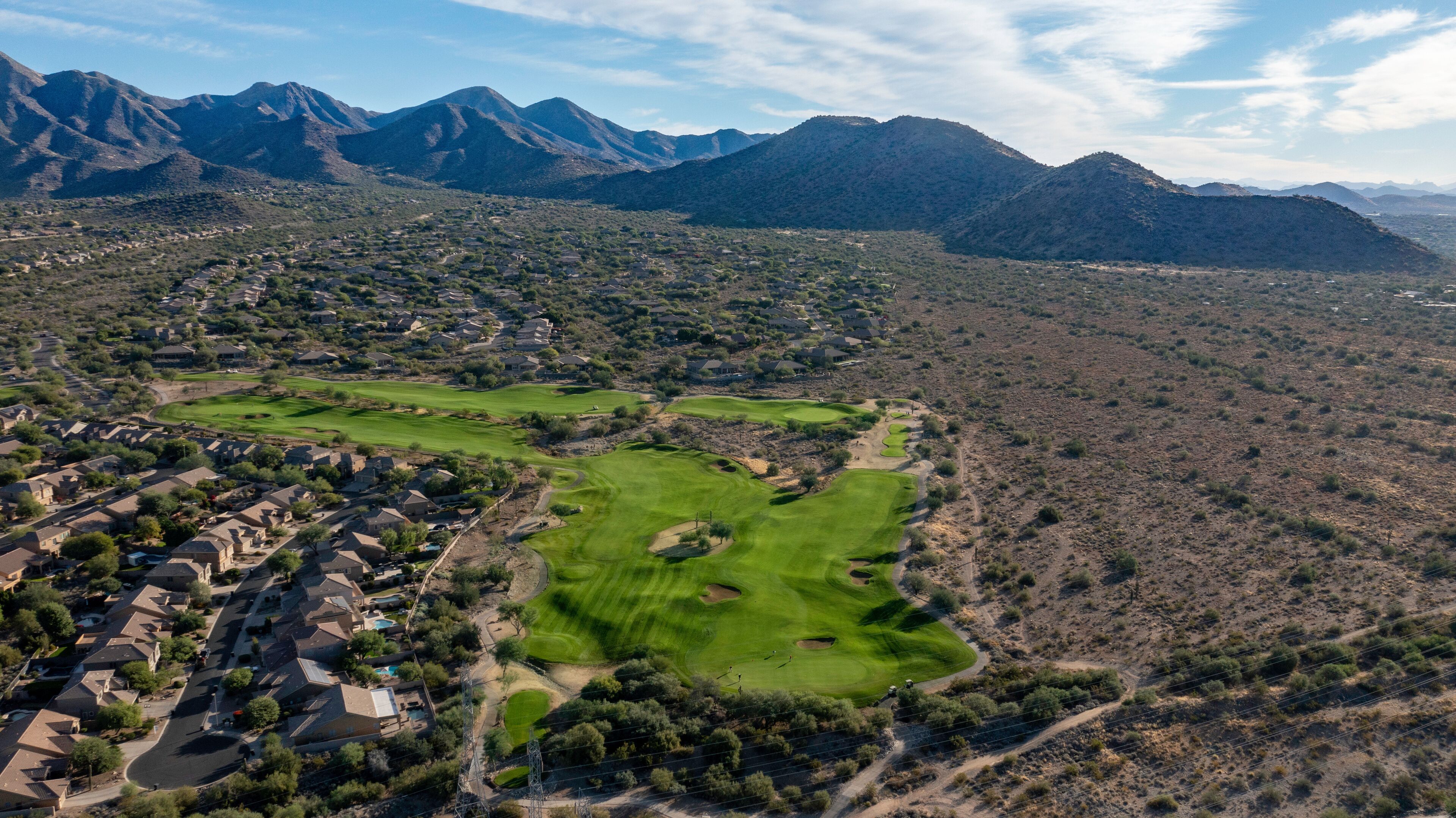 Aerial golf course images of scenic golf holes.