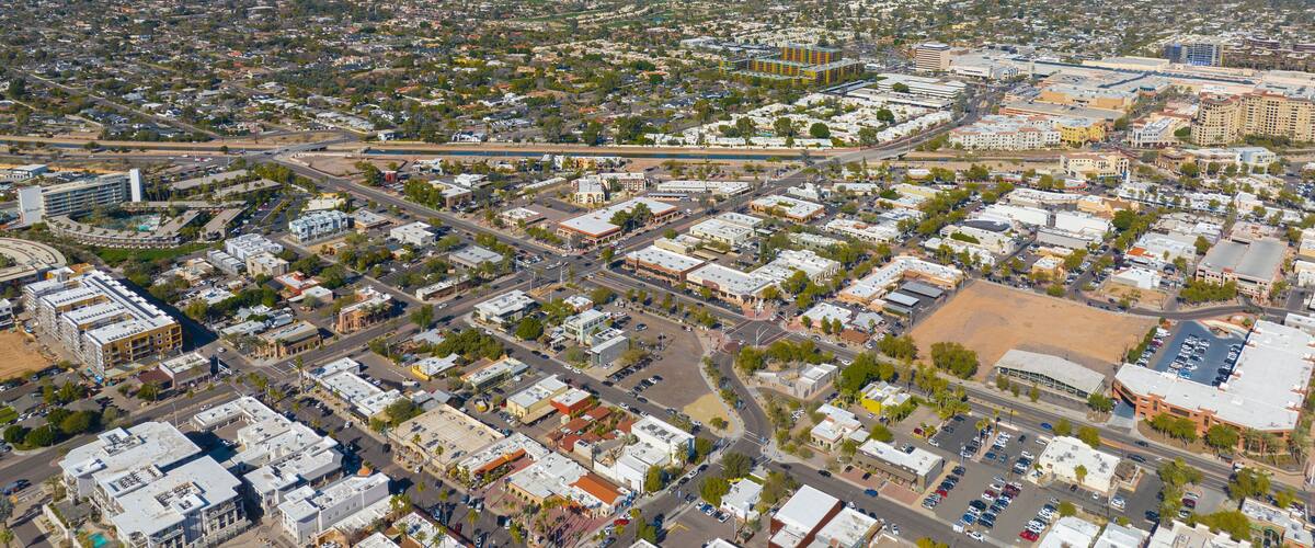 Scottsdale city center aerial view on Scottsdale Road at Main Street with Camelback Mountain at the background in city of Scottsdale, Arizona AZ, USA.