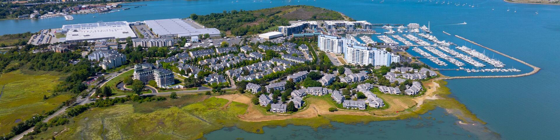 Marina Bay aerial view with Boston modern city skyline at the background in Quincy Bay in city of Quincy, Massachusetts MA, USA.