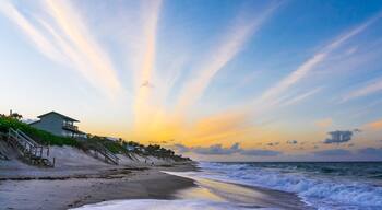 Orange clouds in the form of diverging rays at sunset on the ocean in Melbourne Beach, Florida