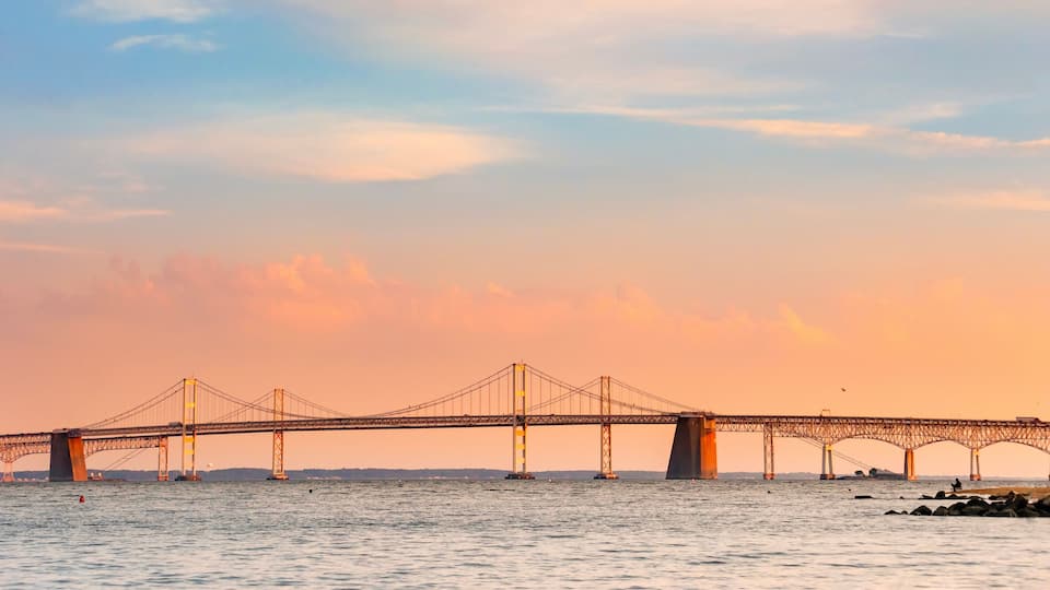 Chesapeake Bay Bridge with blue and orange sunset