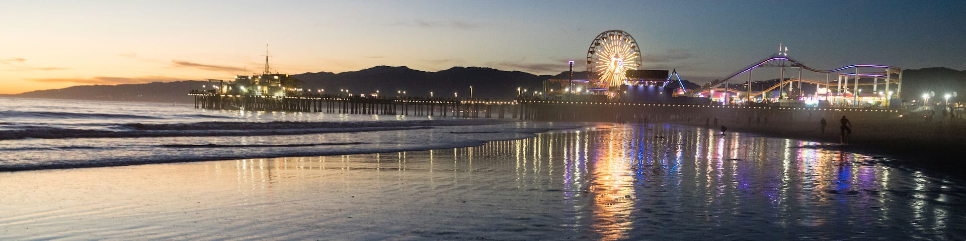 People Frolic in the Water on the Beach in Santa Monica, CA