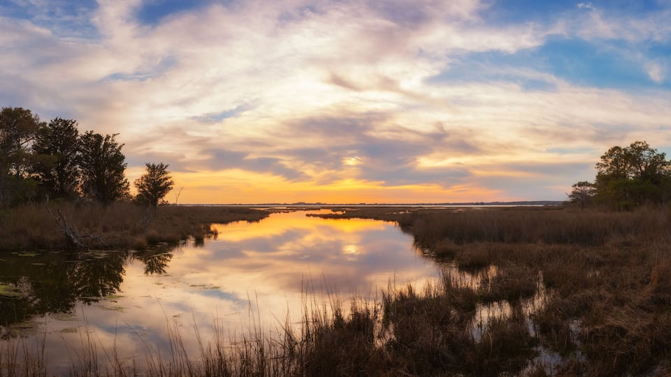 Panoramic sunset over wetlands at Assateague Island in Maryland