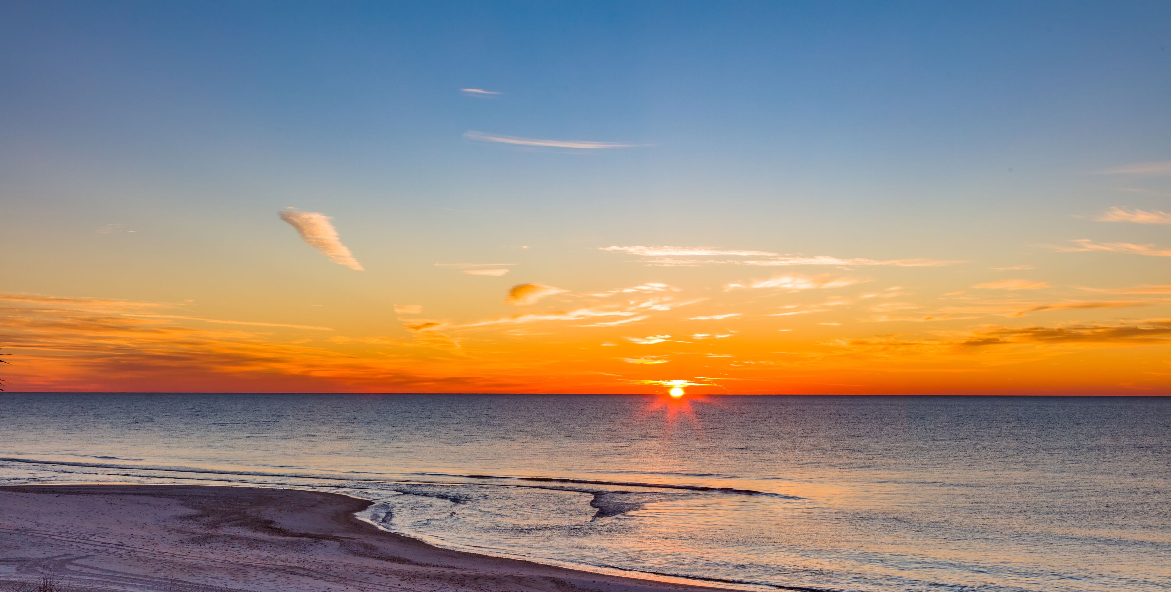 Sunrise over Gulf of Mexico on  St George Island in the panhandle or forgotten coast area of Florida in the United States