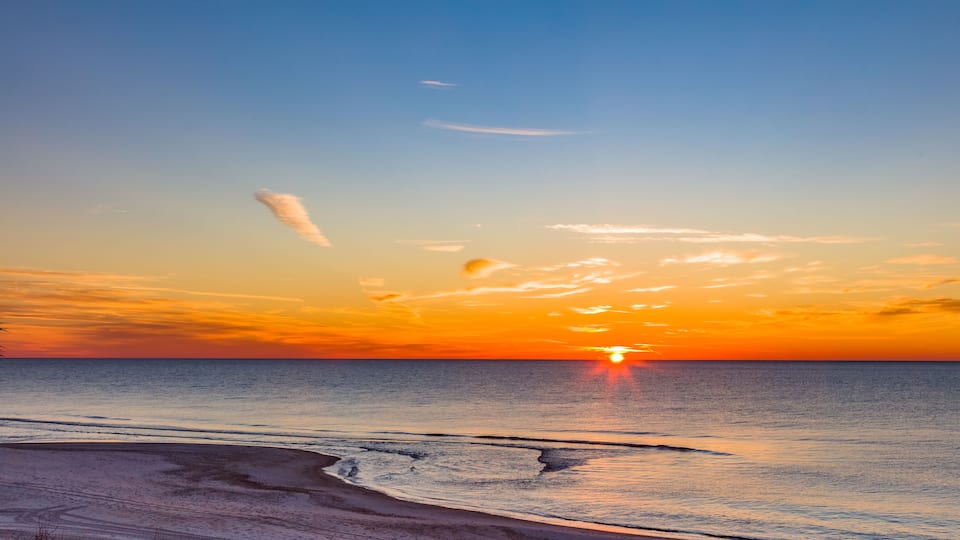 Sunrise over Gulf of Mexico on St George Island in the panhandle or forgotten coast area of Florida in the United States