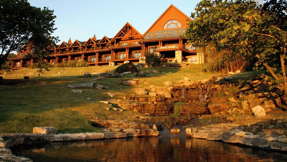 Falls Lodge as the sunsets. One of the 3 buildings with "hotel" accommodations at Big Cedar Lodge in additions to the cabins. Falls Lodge has rooms featuring two double beds and king bed rooms that feature gas fireplaces. The views are of the ground and Table Rock Lake are beautiful and the lobby is a mic enlace to relax with some wine and enjoy one of the two gas fire places.