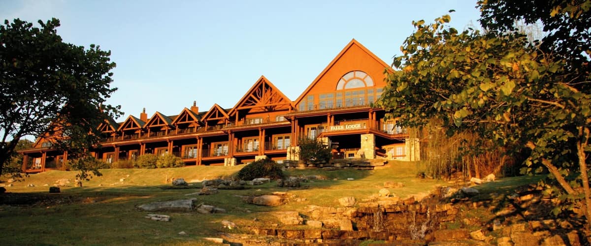 Falls Lodge as the sunsets.  One of the 3 buildings with "hotel" accommodations at Big Cedar Lodge in additions to the cabins. Falls  Lodge has rooms featuring two double beds and king bed rooms that feature gas fireplaces.  The views are of the ground and Table Rock Lake are beautiful and the lobby is a mic enlace to relax with some wine and enjoy one of the two gas fire places.