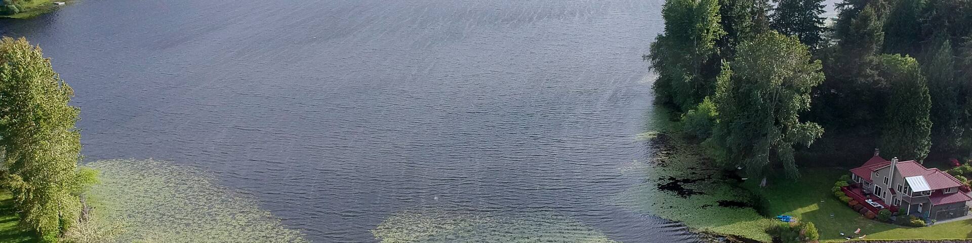 Picturesque Phantom Lake and the surrounding sprawling communities of Robinswood, Lake Hill and West Lake Sammamish in Bellevue, Washington.