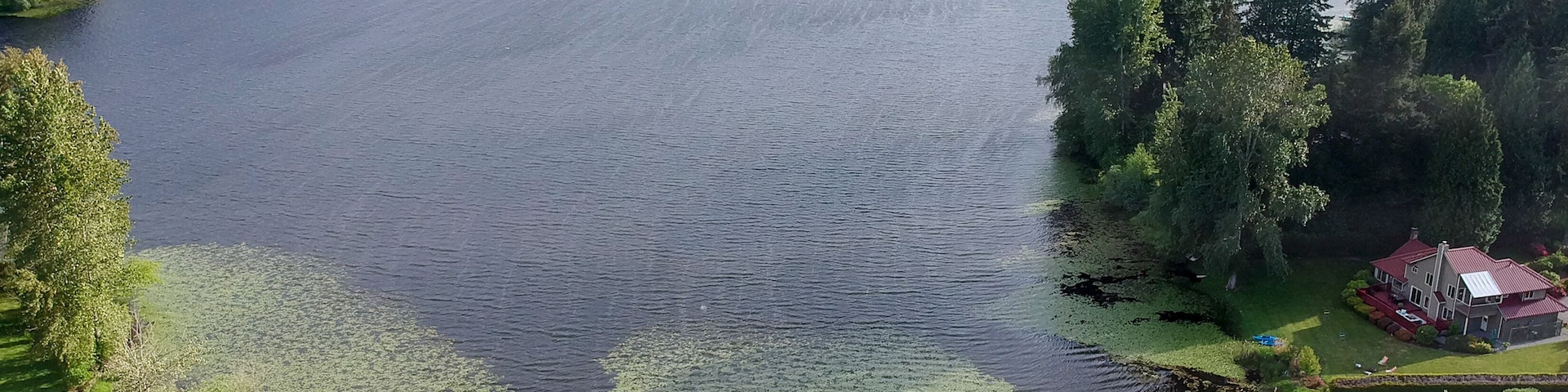 Picturesque Phantom Lake and the surrounding sprawling communities of Robinswood, Lake Hill and West Lake Sammamish in Bellevue, Washington.