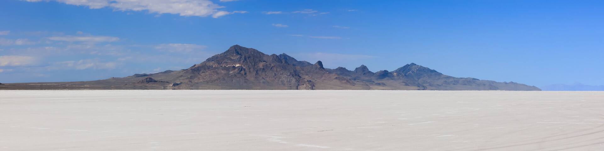 Scenic panoramic view of Bonneville salt flats in Utah during sunny summer day.