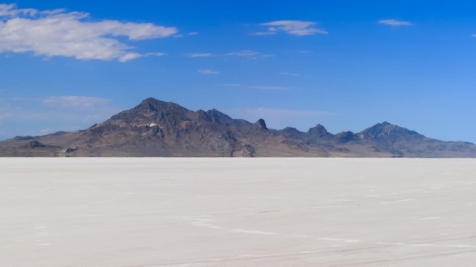 Scenic panoramic view of Bonneville salt flats in Utah during sunny summer day.
