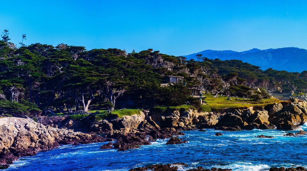 Sunset Point - Pebble Beach, California, February 17, 2018: Beautiful sea and rocky point vista along the 17 Mile Drive south of Cypress Point Golf Course overlooking Sunset Point.