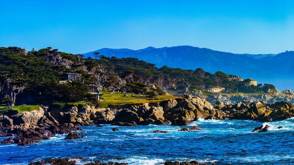 Sunset Point - Pebble Beach, California, February 17, 2018: Beautiful sea and rocky point vista along the 17 Mile Drive south of Cypress Point Golf Course overlooking Sunset Point.