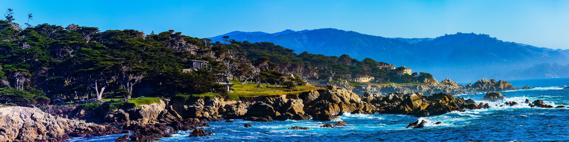 Sunset Point - Pebble Beach, California, February 17, 2018: Beautiful sea and rocky point vista along the 17 Mile Drive south of Cypress Point Golf Course overlooking Sunset Point.