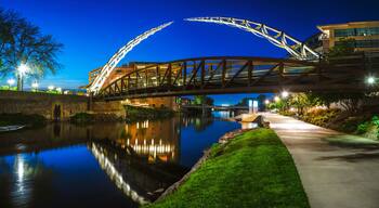 Sioux Falls Downtown River Greenway Lighted Trail, Skyline, Bridges, and Reflectoins on the Big Sioux River Water at Night in South Dakota, USA