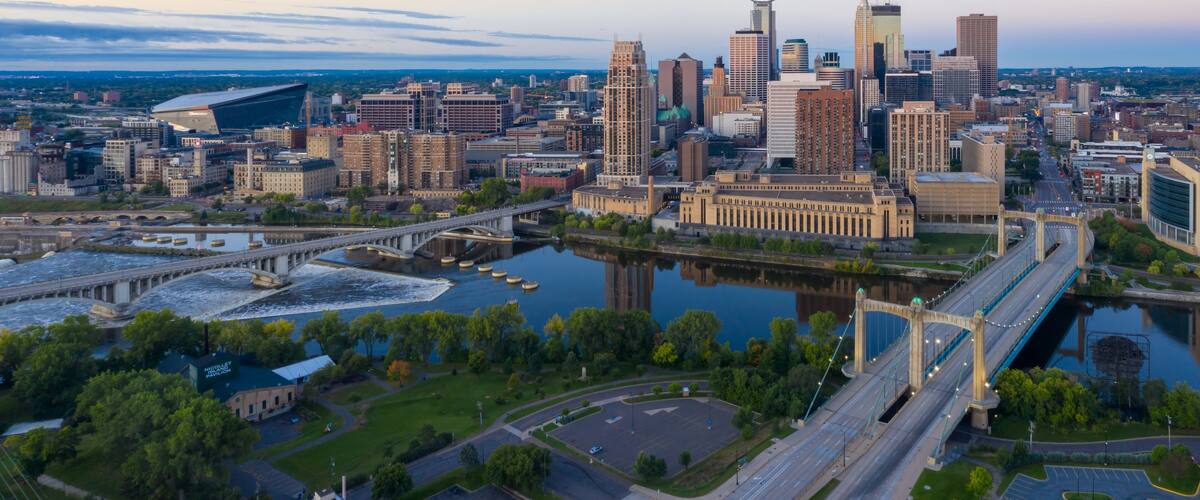 Aerial view of Minneapolis skyline at dawn, showcasing the city's architecture, bridges, and the Mississippi River. Urban landscape. Nicollet Island, Minneapolis, Minnesota, United States