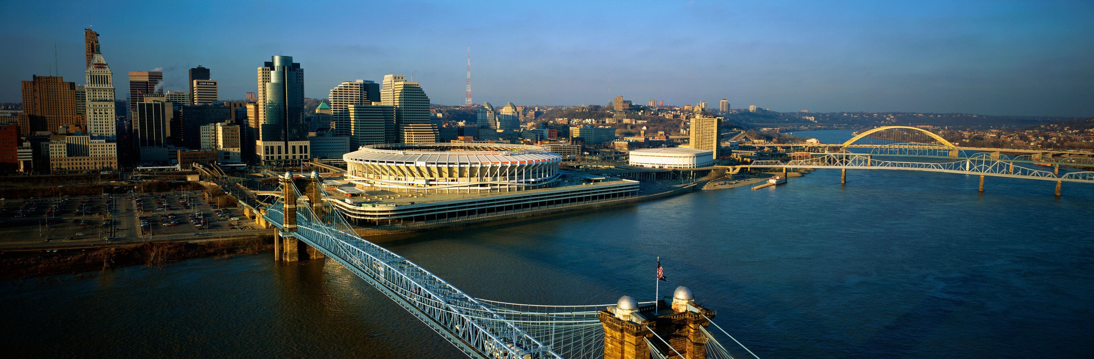This is the Ohio River with the Roebling Suspension Bridge over it. At the end of the bridge is Three Rivers Stadium and the Cincinnati skyline.