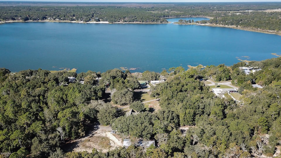 Aerial view of a lake in Keystone Heights Florida. Flying a drone over the lake.