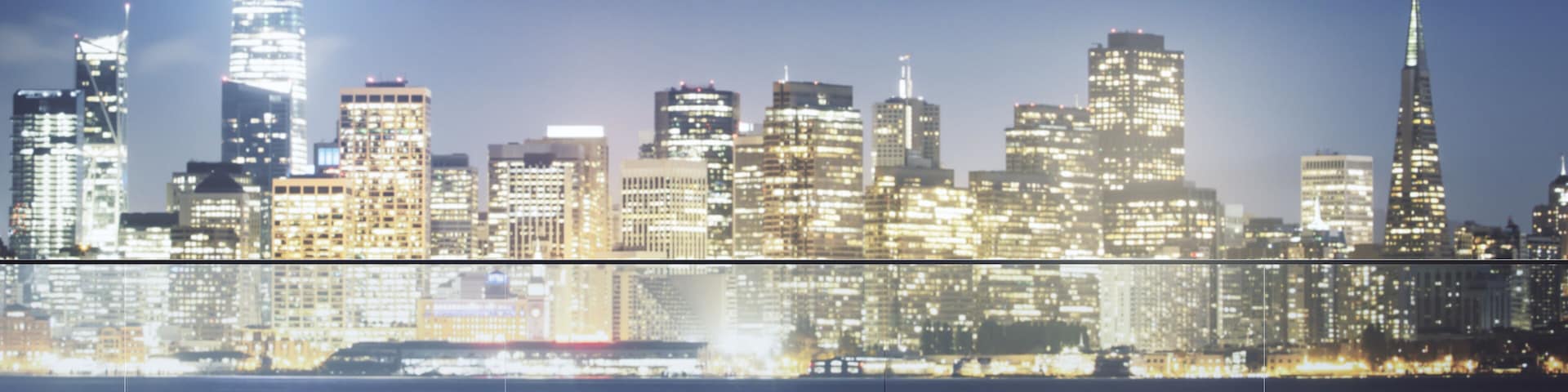 Modern glass roof of skyscraper on night cityscape background.