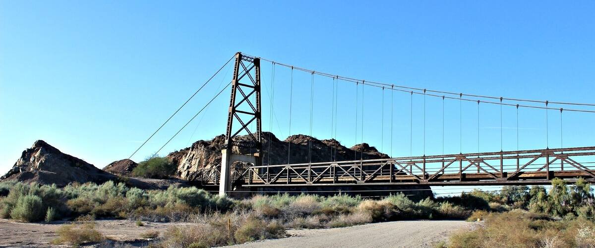The Golden Gate Bridge is the McPhaul bridge's twin. This 798 ft suspension bridge, named the 'swinging bridge to nowhere' was built in 1929. Located off Hwy 95, take dirt road behind produce store. #localgem