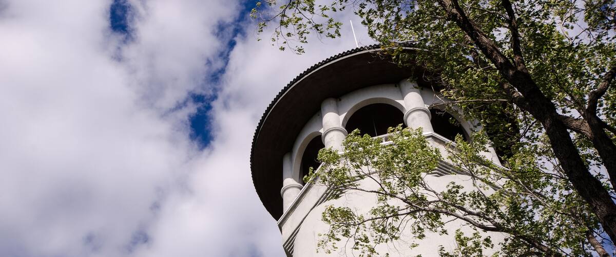 Witches Hat Water Tower in Prospect Park, Minneapolis Minnesota, on a partly cloudy day